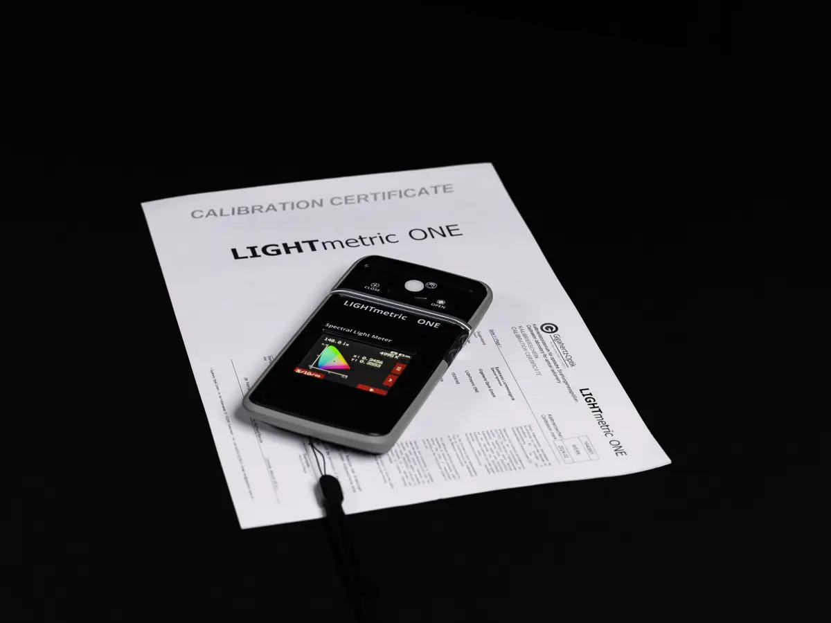 LIGHTmetric ONE spectral light meter on its ISO/IEC 17025 calibration certificate